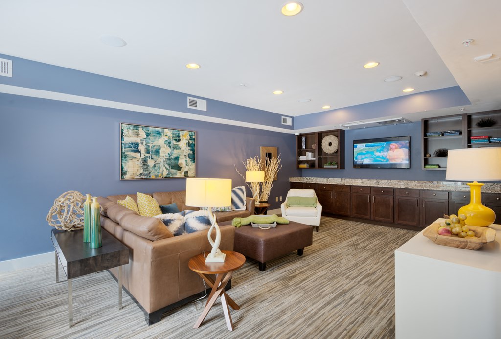 a living room with blue walls and a striped carpet