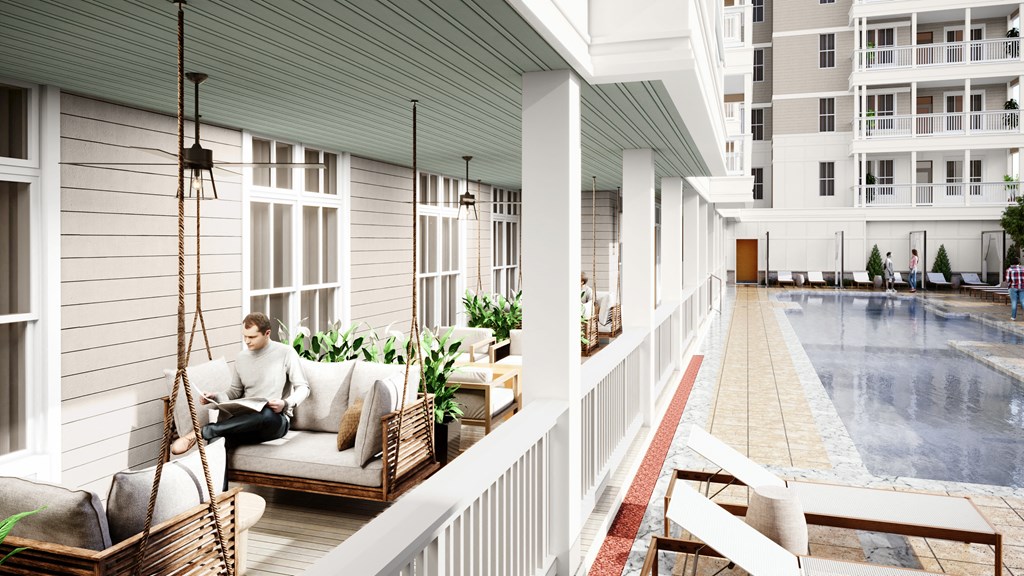 a rendering of a man sitting on a couch on a porch with a pool in the background