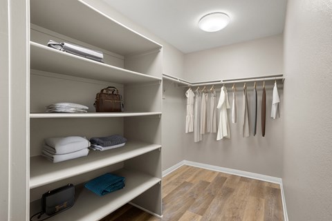 a walk in closet in a 555 waverly unit