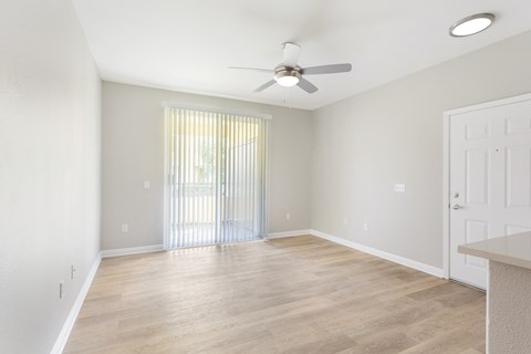 a bedroom with hardwood flooring and a ceiling fan