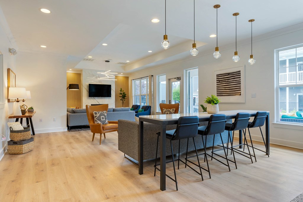 a living room filled with furniture and a large window