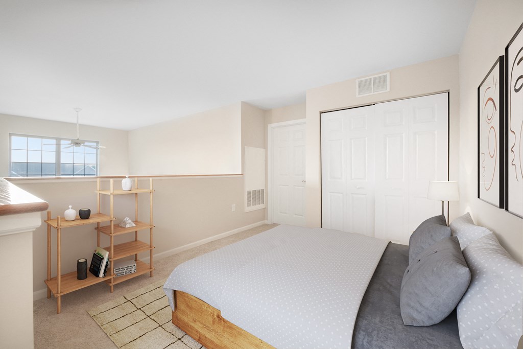 a bedroom with a bed and a door to a bathroom