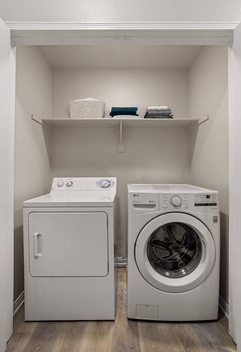 a small laundry room with a washer and dryer