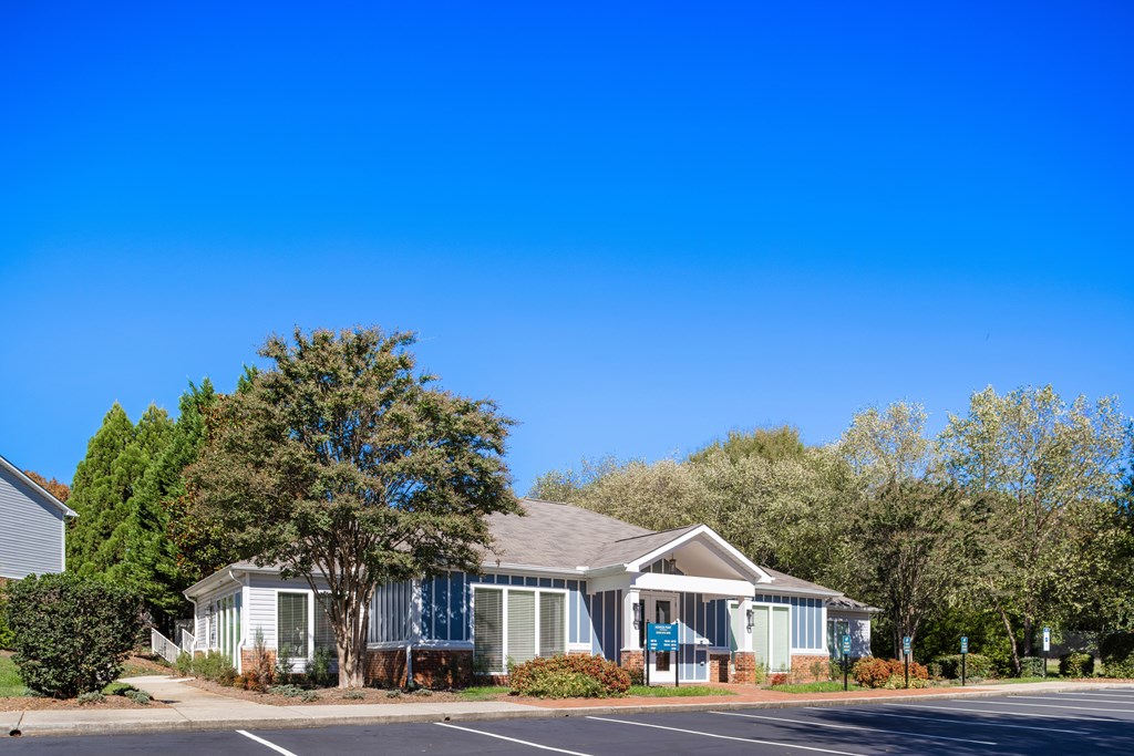 A building with a parking lot in front of it.