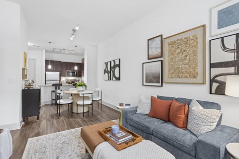 A living room with a grey couch and a coffee table.