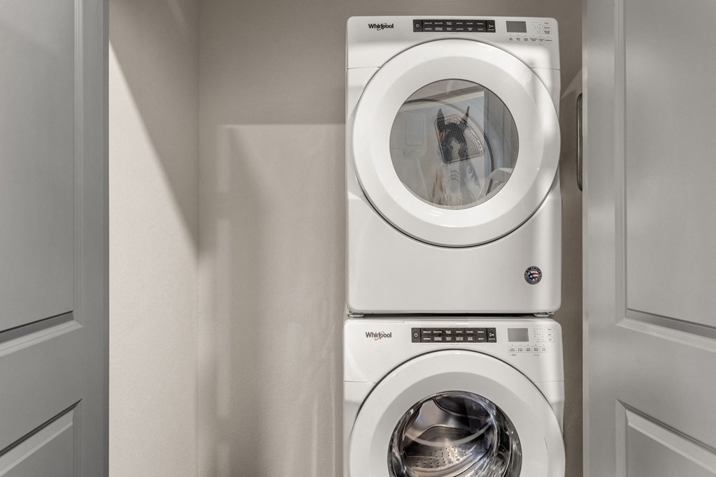 a white washer and dryer in a laundry room