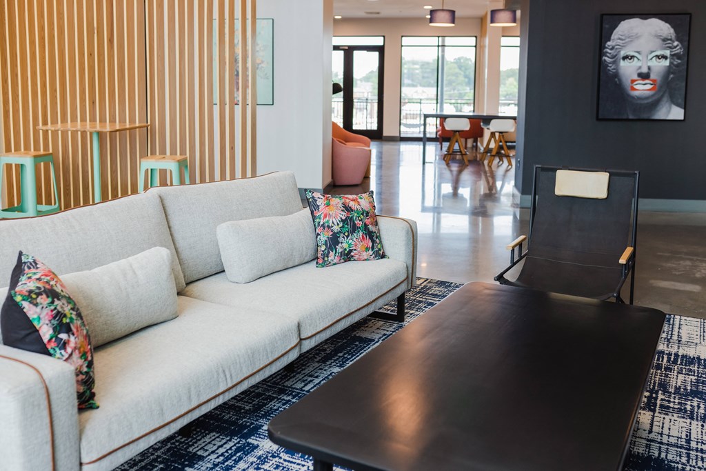 a living room with a white couch and a coffee table