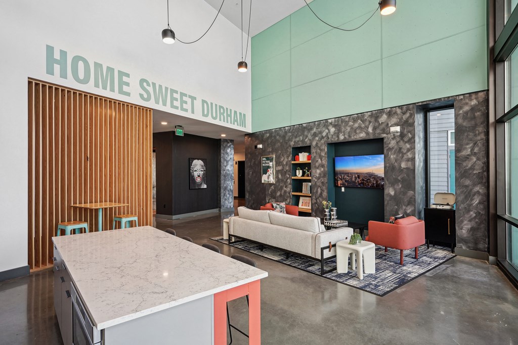 a living room with a kitchen and a couch and a table