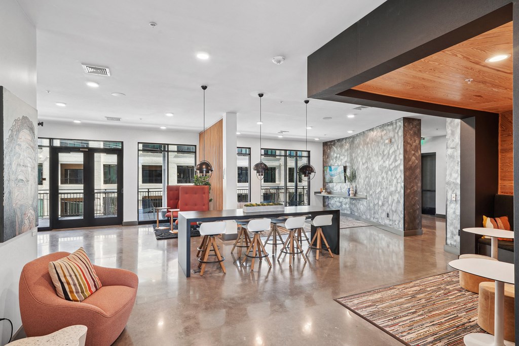 a large living room with a dining area and a kitchen
