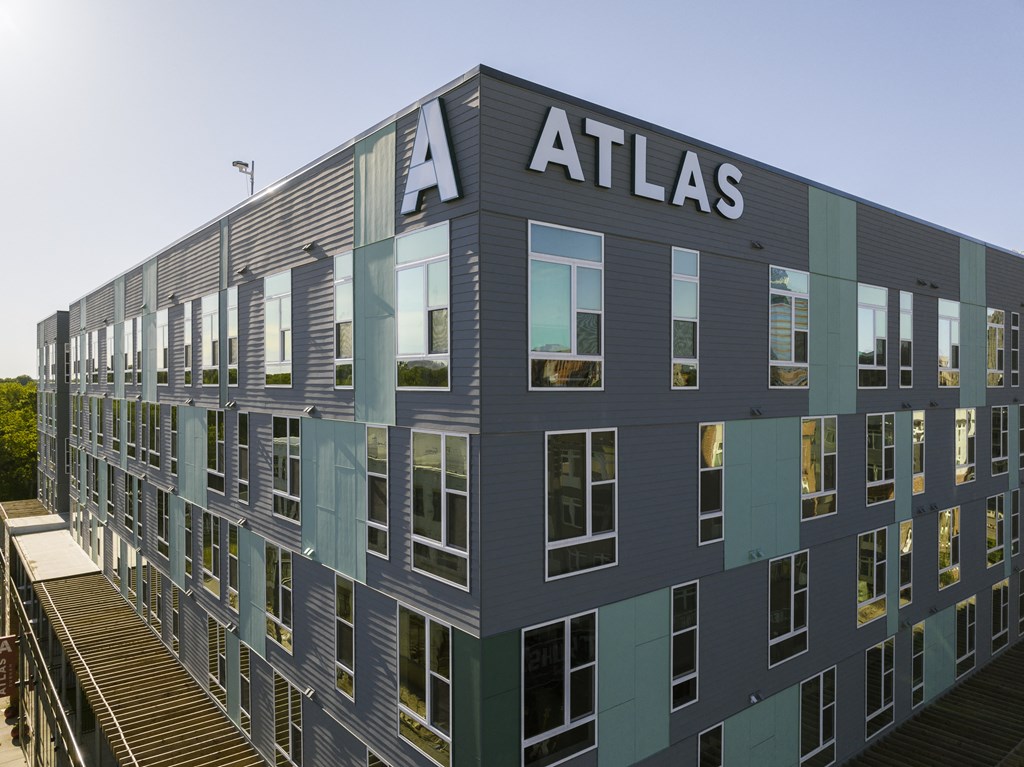 a building with atlas signage on the side of it