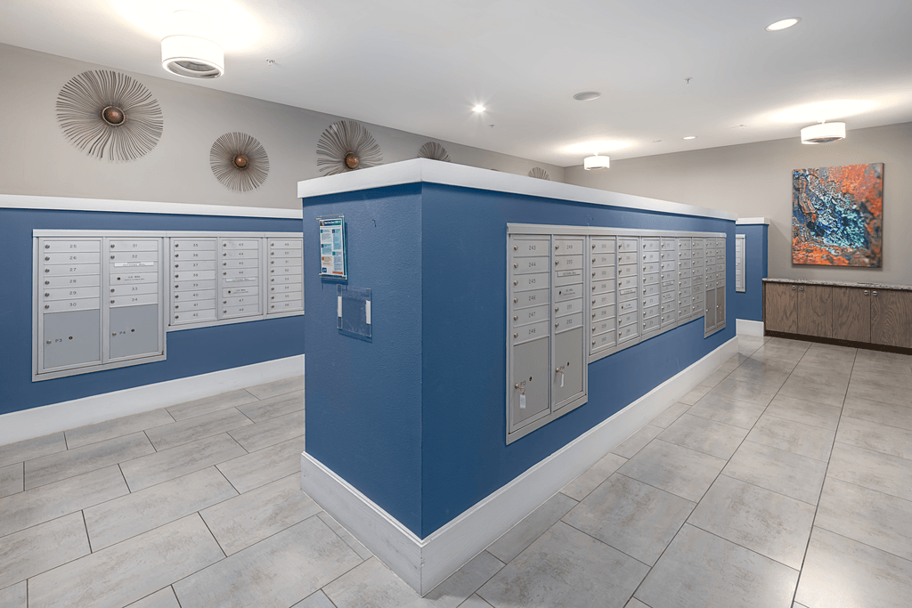A room with a blue wall and a white ceiling.