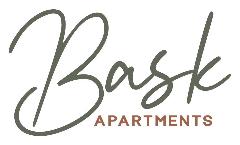The image is of a logo for Bask Apartments.