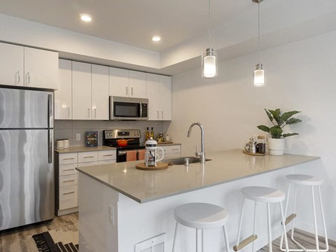 a kitchen with a counter top and a refrigerator