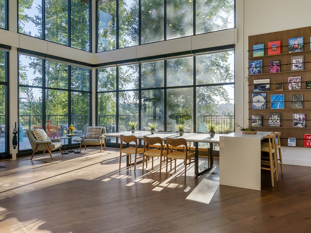 Clubhouse seating with floor to ceiling windows overlooking Marymoor Park