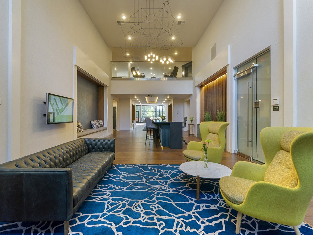 Leasing office with seating and entry to clubhouse