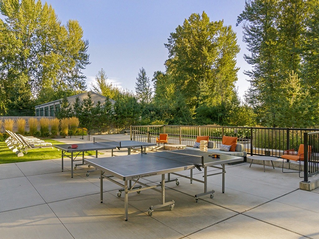 Outdoor seating with ping pong and view of Marymoor Park