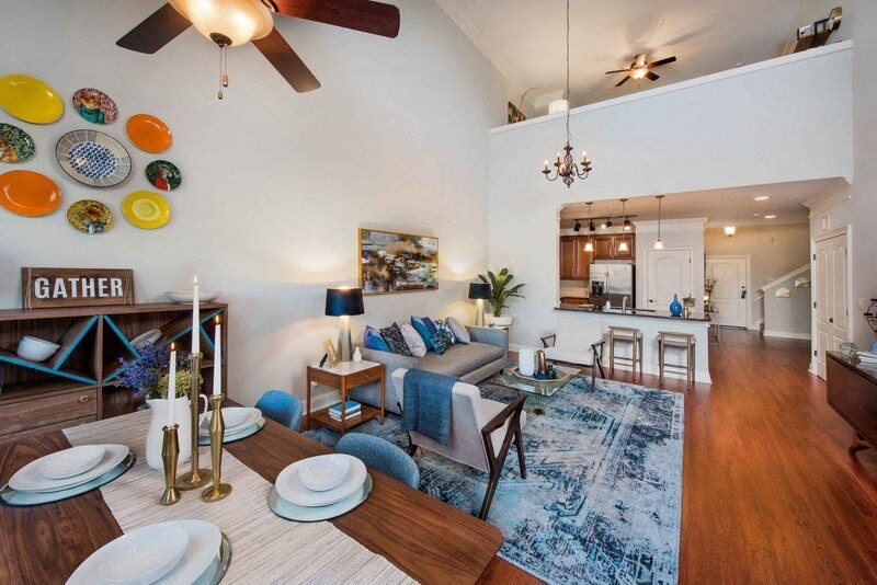 a living room with a couch and a dining table