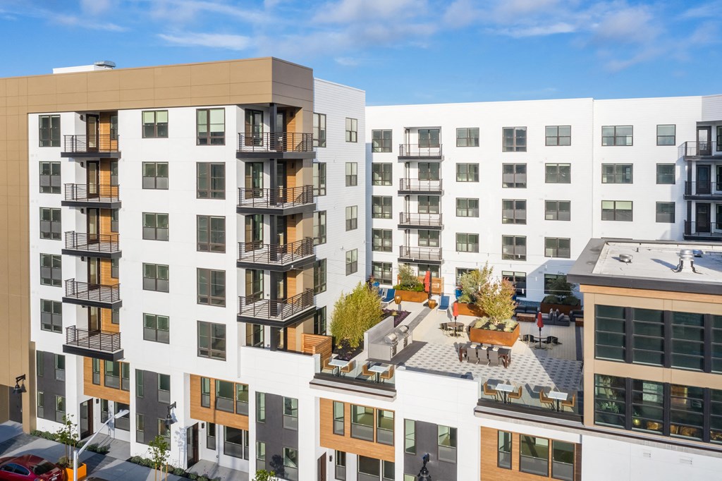 exterior building drone shot overlooking roof top courtyard