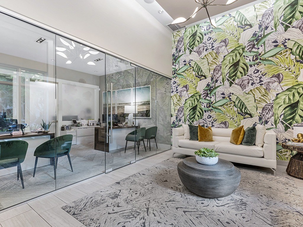 a living room with a couch and a table with chairs