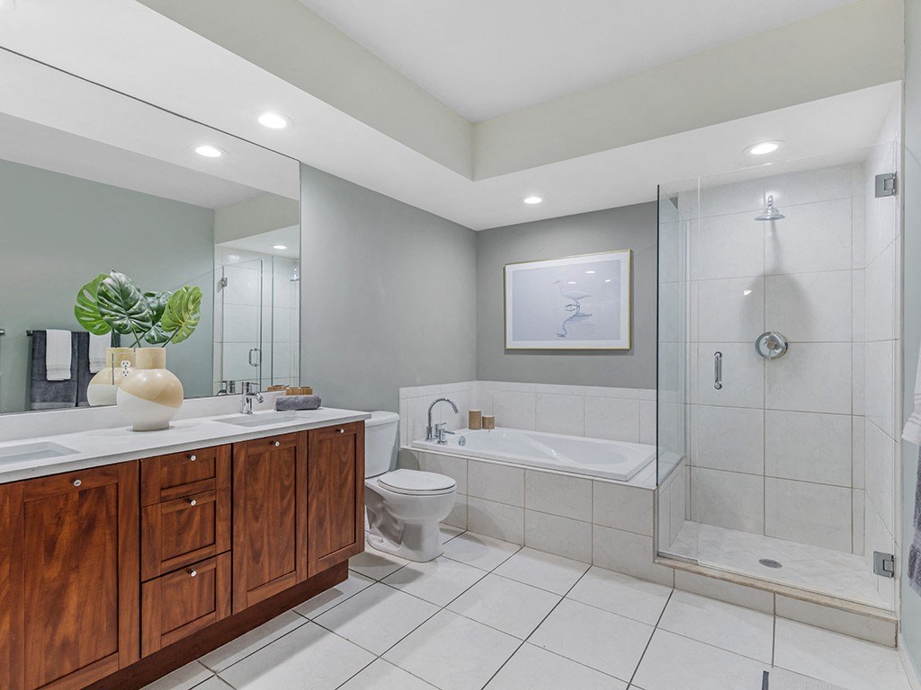 a bathroom with a toilet sink and a shower