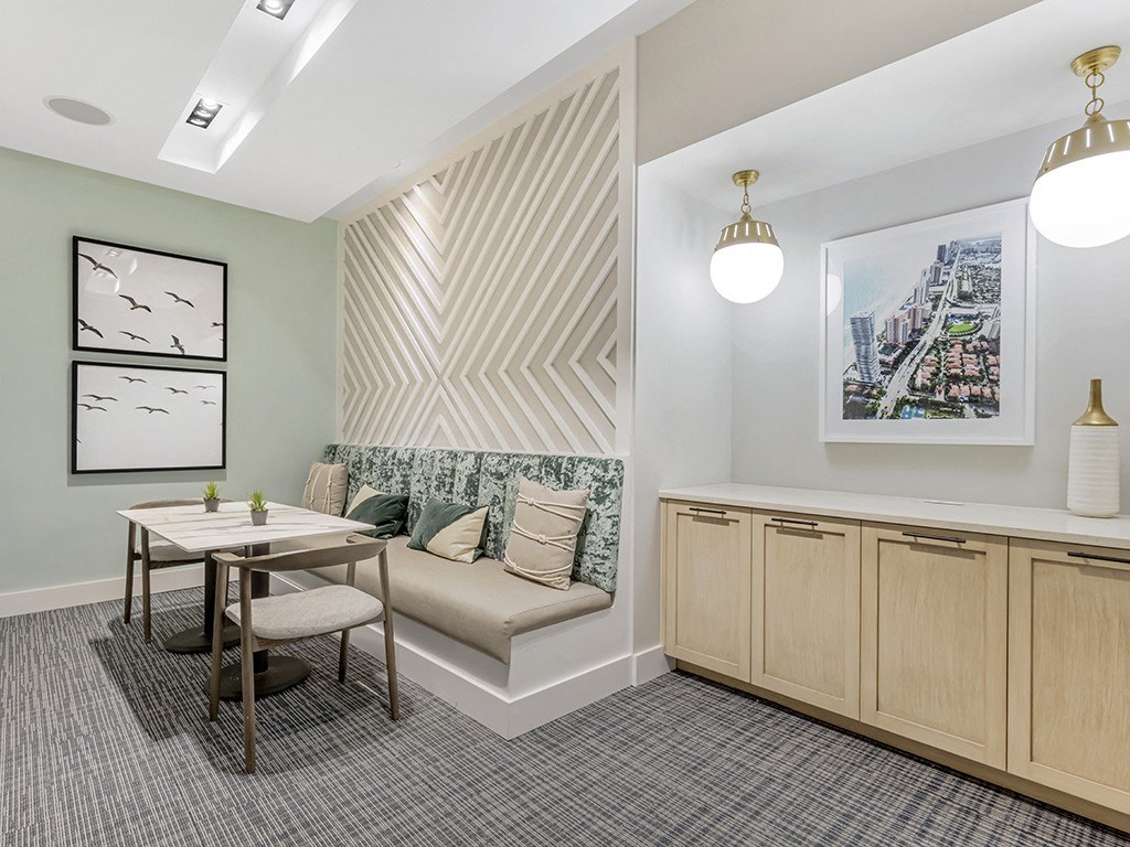 a dining room with a table and a couch