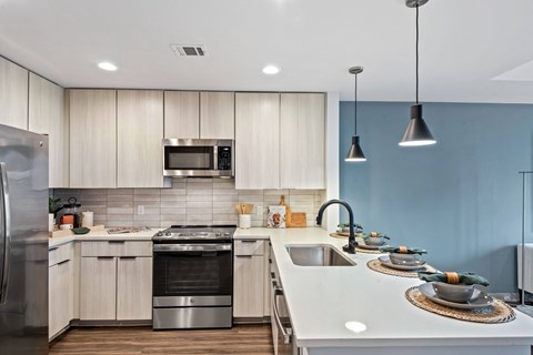 a kitchen with a counter top and a sink