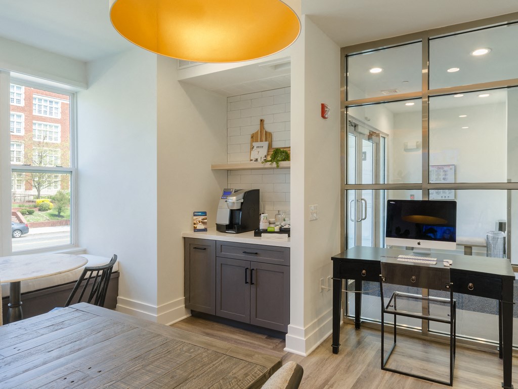 a kitchen and dining room with a table and a tv