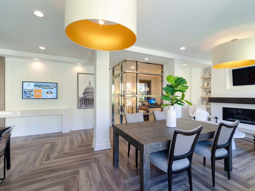 a dining room and living room with a table and chairs