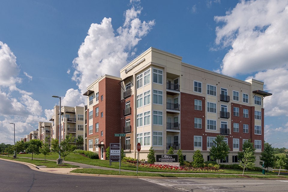 an apartment building on the corner of a street