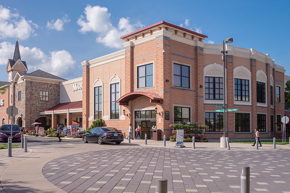 a large brick building on the corner of a street