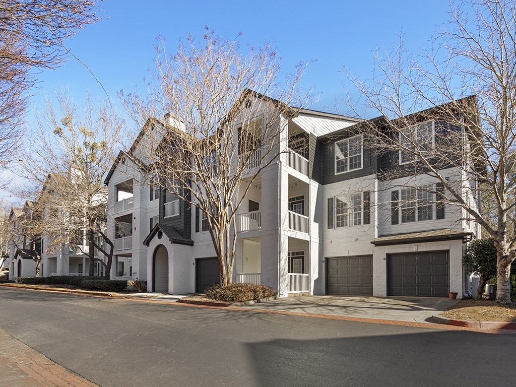 a picture of a house with a street in front of it