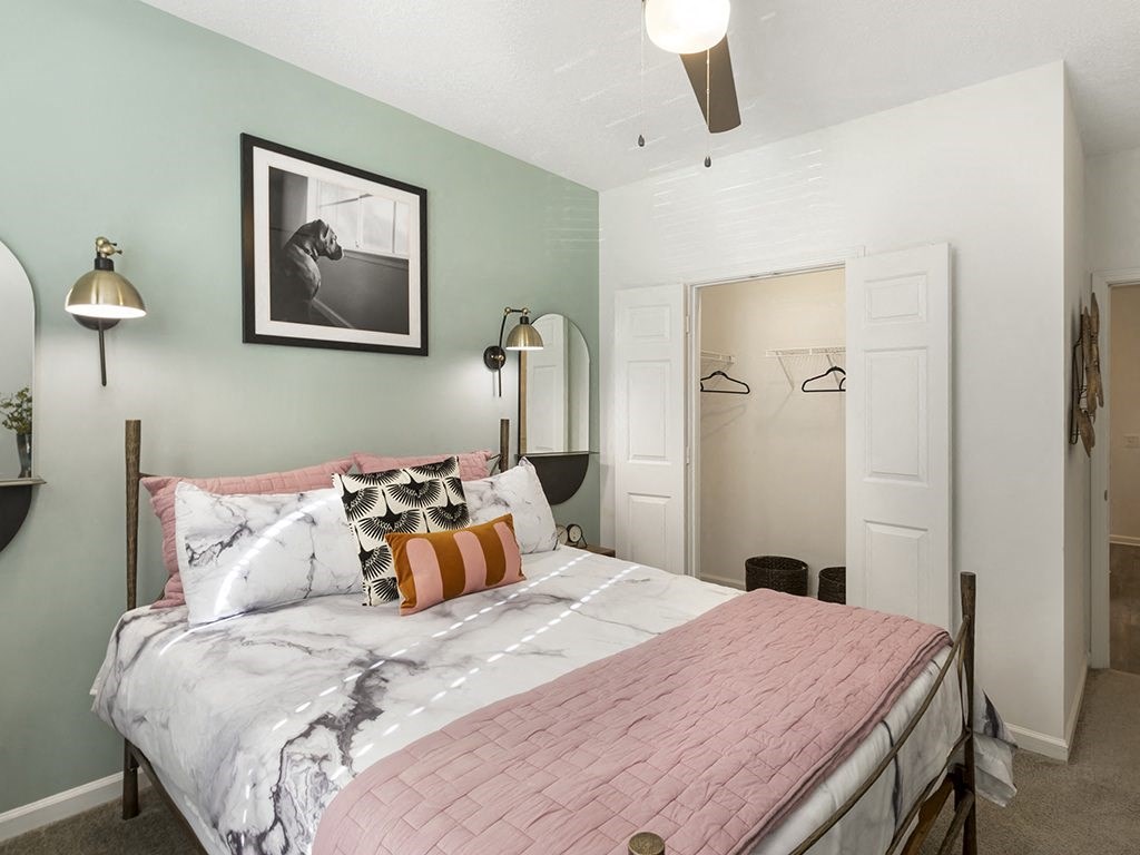 a bedroom with a bed and two closets