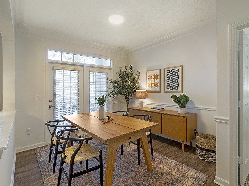 a dining room with a table and chairs