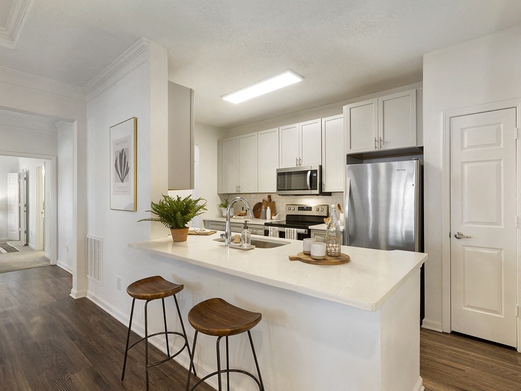 a kitchen with an island and two stools