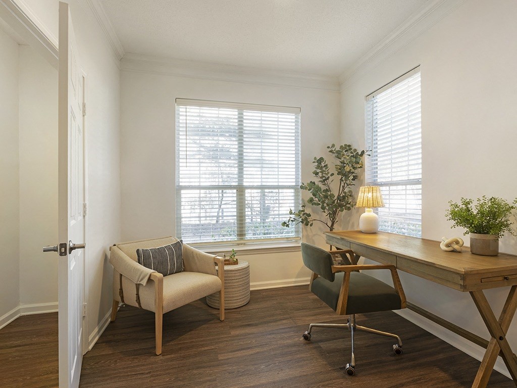 a home office with a chair and desk