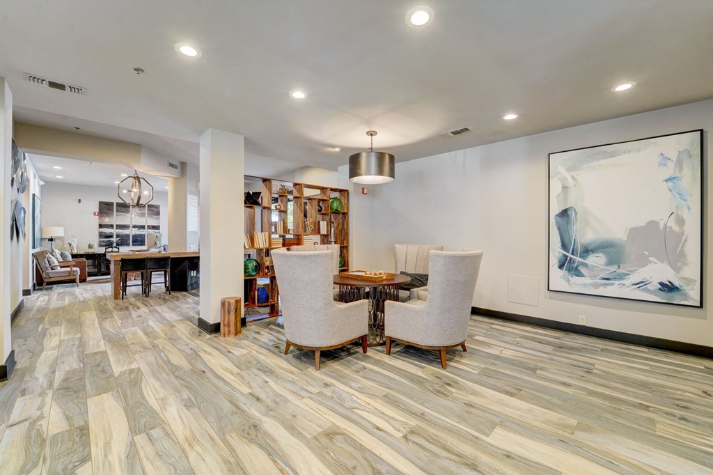 the reserve at city center spacious living room with table and chairs