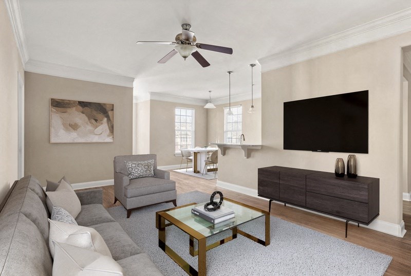 a living room filled with furniture and a flat screen tv