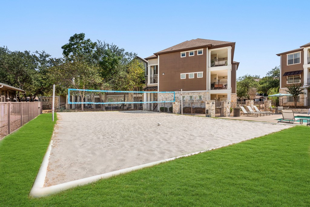the volleyball court at the preserve at ballantyne commons apartments tx