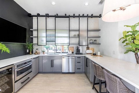 a kitchen with stainless steel appliances and a counter top