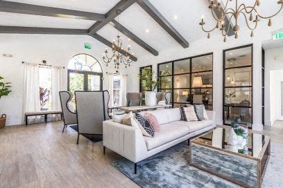a living room with a white couch and a table