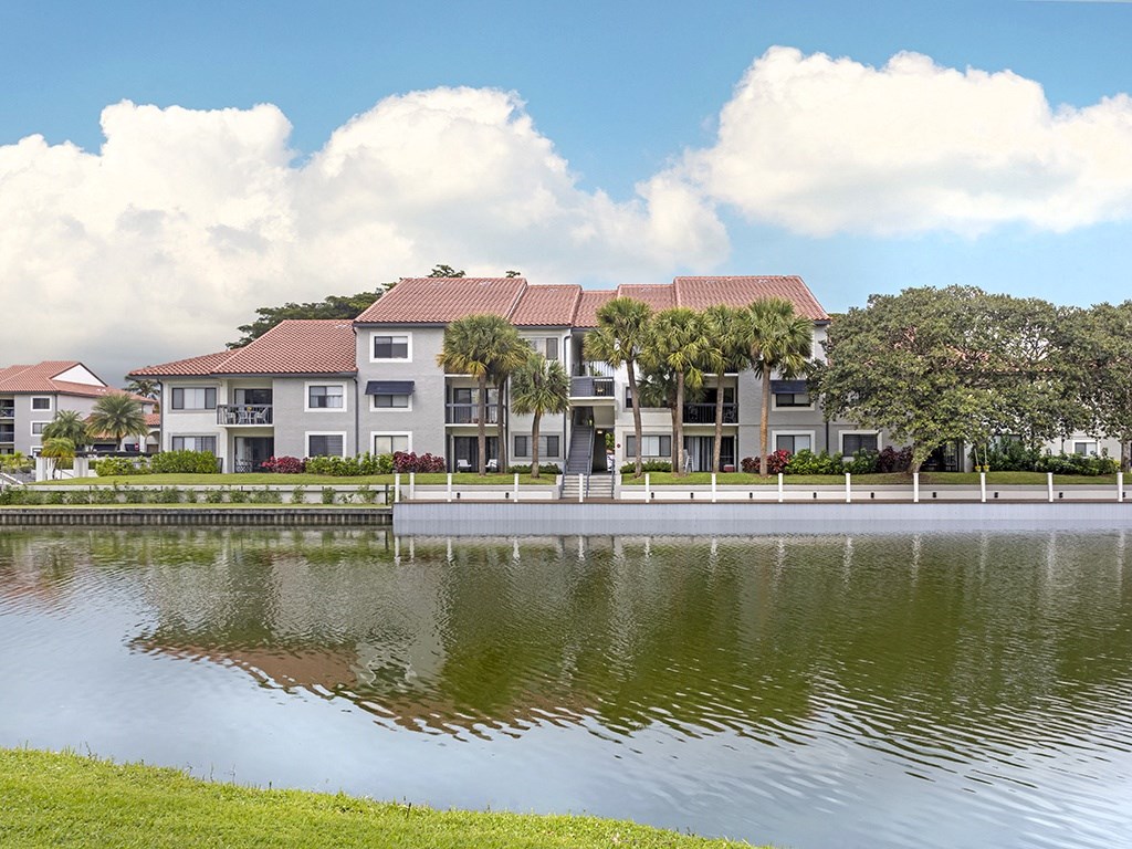 an apartment building overlooking a body of water