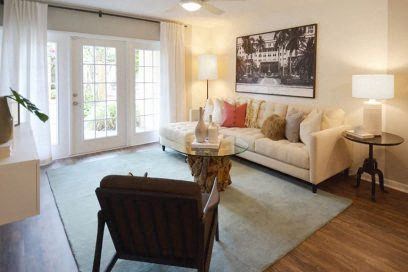 A living room with a sofa, a chair, and a coffee table.