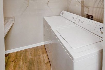 a white washer and dryer in a laundry room