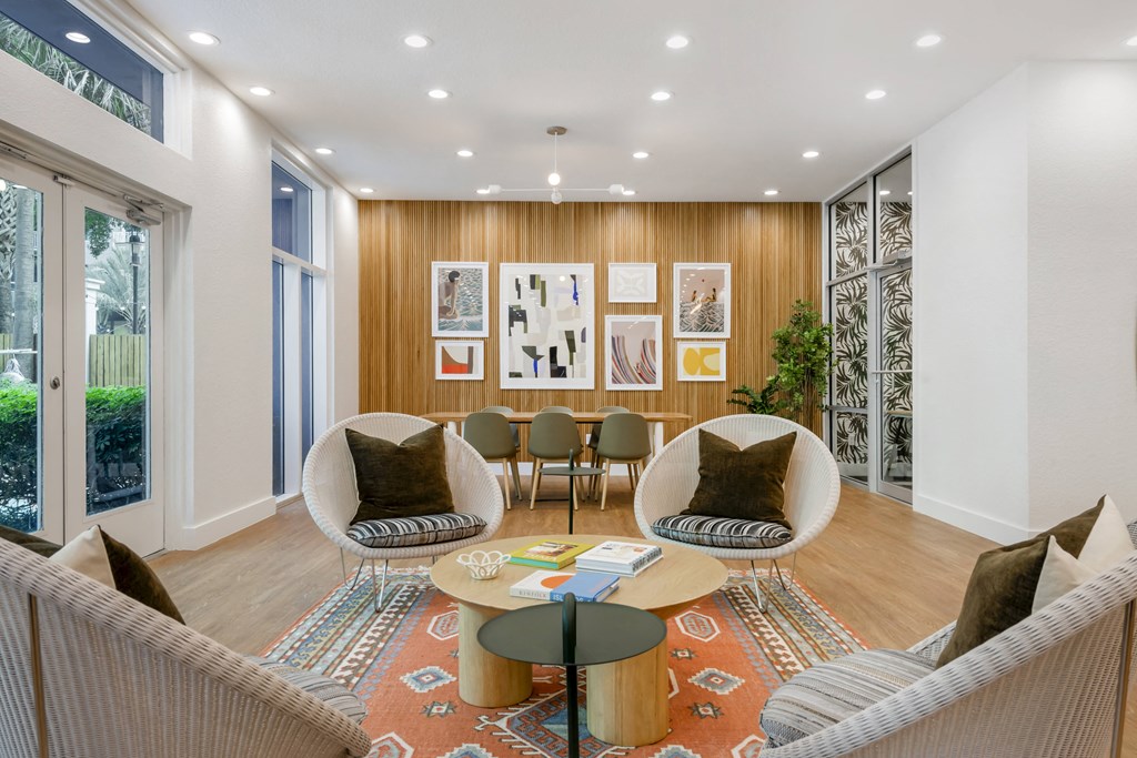 a living room with couches and chairs and a table