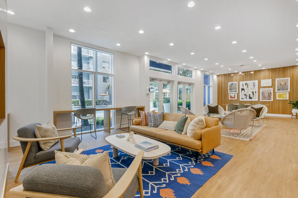 a living room with couches and chairs and a table