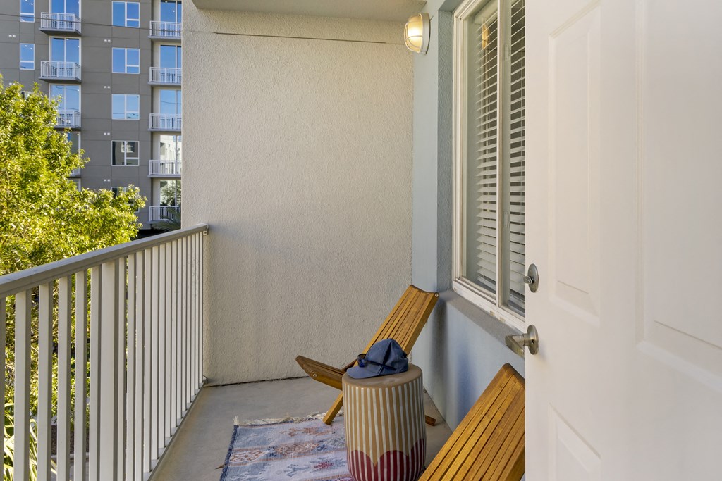 a balcony with chairs