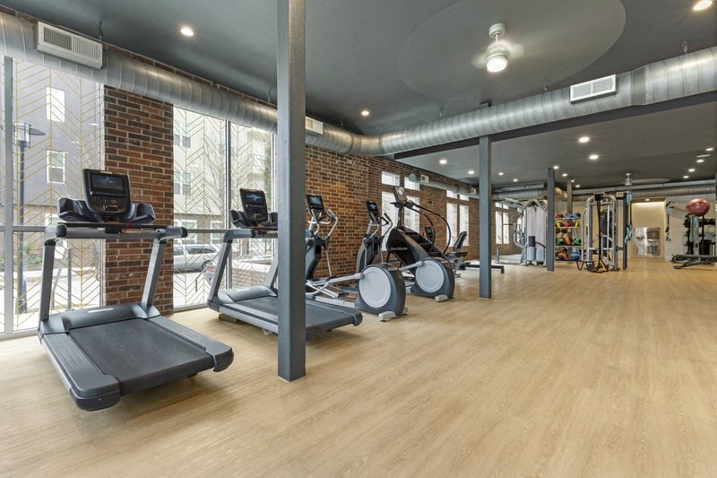 the gym at the district flats apartments in lenexa, ks