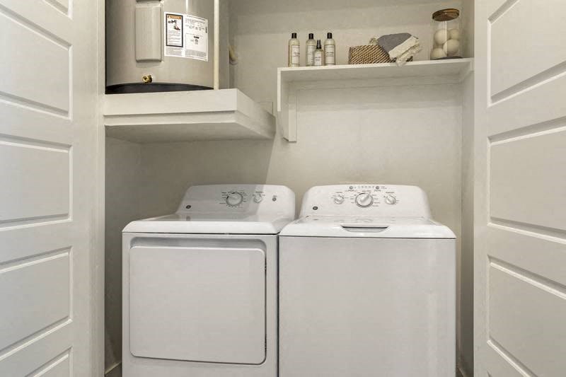 a white washer and dryer in a room