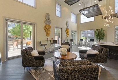 a living room with couches and chairs and a table