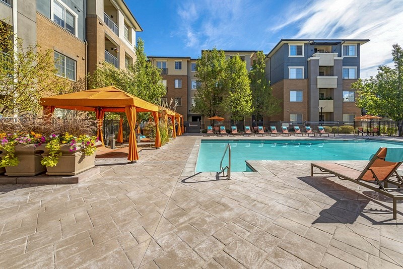 our apartments have a resort style pool with umbrellas
